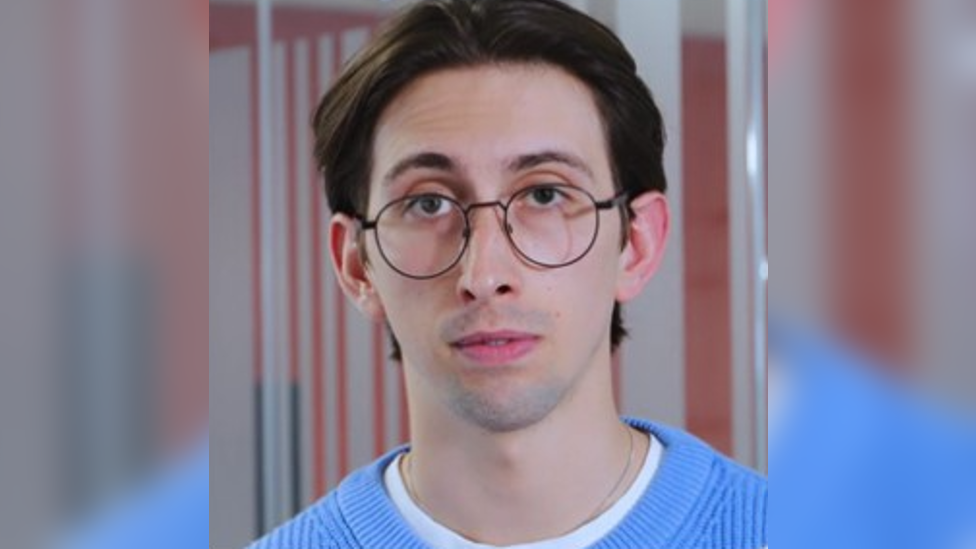 Harry O'Higgins wearing a blue t-shirt and glasses