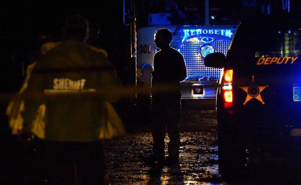 Emergency crews gather at the scene after a storm ripped through a mobile home killing several people in Rehobeth, Alabama, on January 2, 2017.