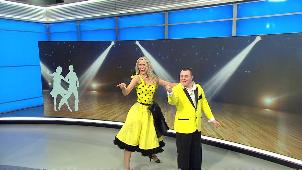 Nathan Morris and his partner Jo Banham wearing yellow outfits while performing