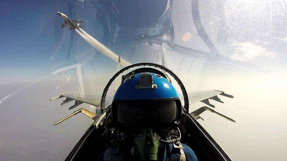 Undated photo of Chinese jet fighters during a military drill in the South China Sea