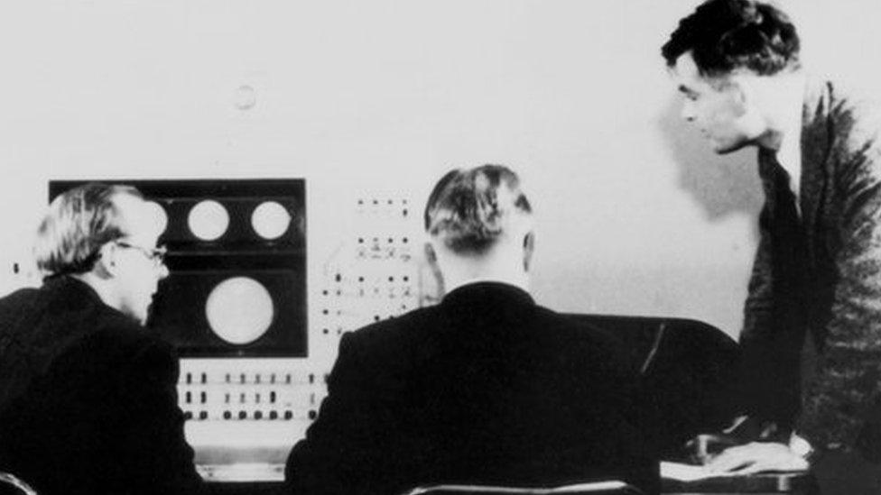 Alan Turing (right) and colleagues working on the Ferranti Mark I Computer, 1951