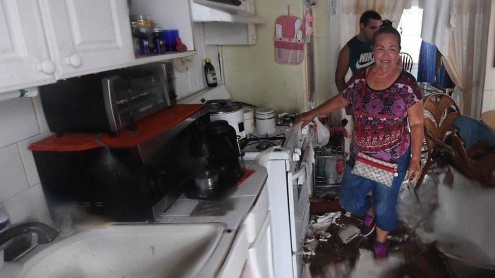 Celina Martinez returns to find their family home badly damaged after Hurricane Harvey hit Rockport (26 August 2017)