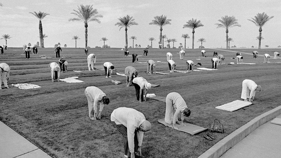 Outdoor group fitness early in the morning in the retirement Sun City, Arizona. Ages range from 60 to a 94 year old who had run a 50secs hundred meters in the Senior Olympics