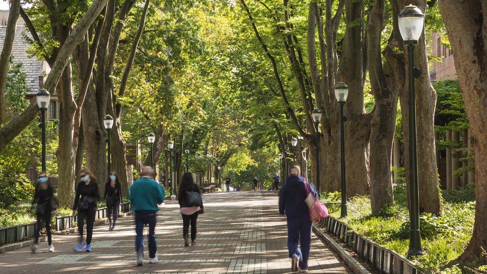 University students walking on pedestrian road near University of Pennsylvania, Philadelphia, USA