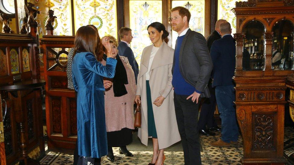 Prince Harry and Ms Markle arrive at the Crown Bar in Belfast