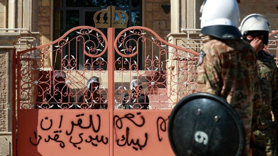 Iraqi security forces stand outside an entrance to the Swedish embassy in Baghdad, after protesters stormed the compound (29 June 2023)