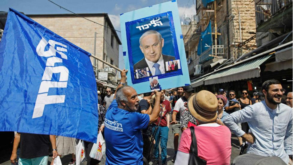 Supporters of Israeli Prime Minister Benjamin Netanyahu march at the Mahane Yehuda Market in Jerusalem on 13 September, 2019.