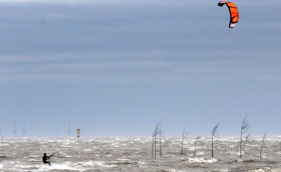 A kite surfer on the Weser river in Bremerhaven, northern Germany, 9 February 2020