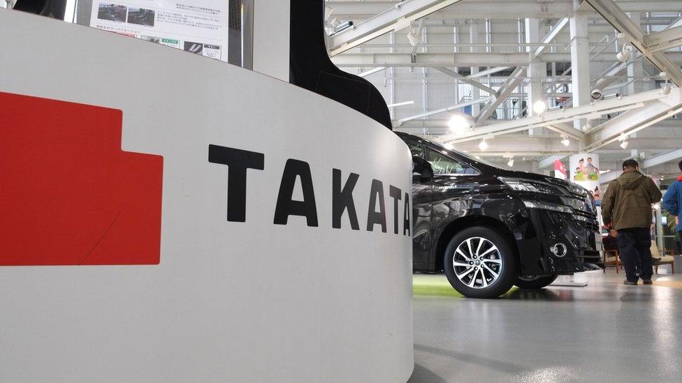 Takata logo in a car showroom