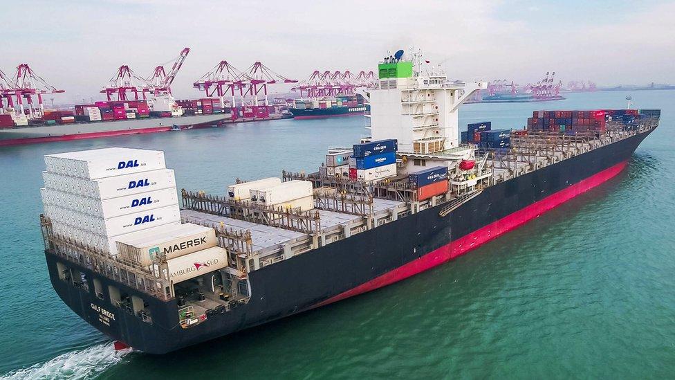 A container ship leaves a Chinese port