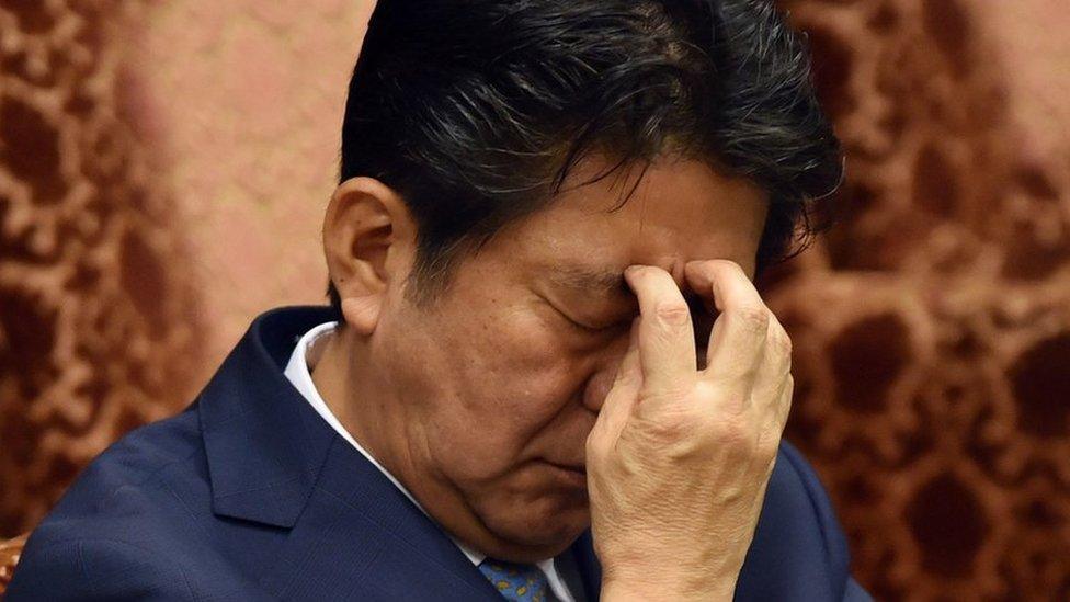 Japan"s Prime Minister Shinzo Abe listens to a question by an opposition lawmaker during an Upper House budget committee session at the National Diet in Tokyo on August 10, 2015.