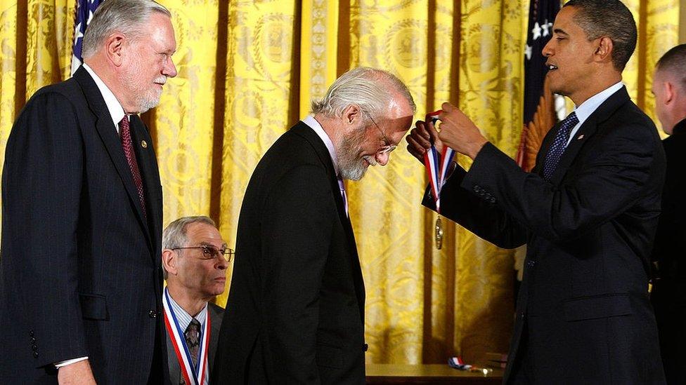 Barack Obama presents a National Medal of Technology and Innovation to John E. Warnock, co-founder of Adobe Systems Inc., as co-founder Charles M. Geschke