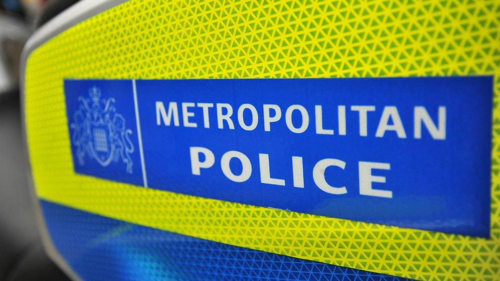 A Metropolitan Police sign on the side of vehicle