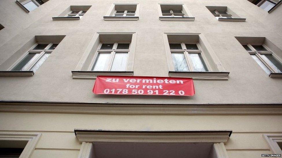 A real estate sign sits on a block of residential apartments advertises a flat for rent in Berlin (April 2013)