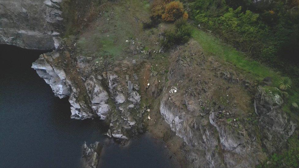 Headstones on slope in Longue Hougue reservoir