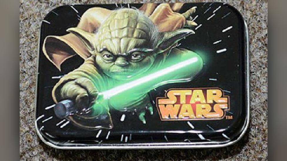 Tin depicting Star Wars character Yoda