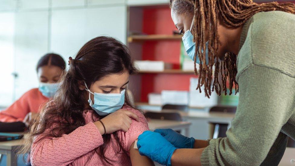 File image of a school nurse treating a pupil