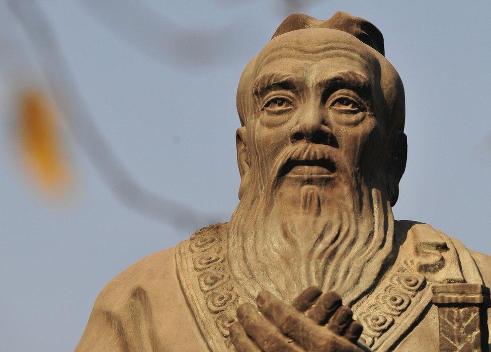 A statue of Confucius, the Chinese philosopher best known for promoting filial piety in the 6th century B.C, is pictured on the grounds of the Confucius Temple in Beijing on 22 November 2008