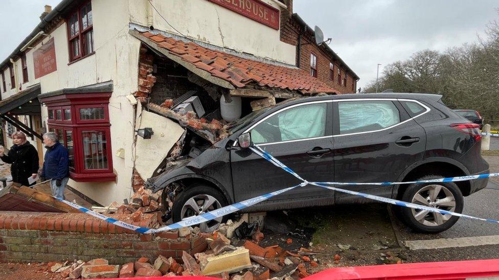 Car in the side of Railway Tavern pub