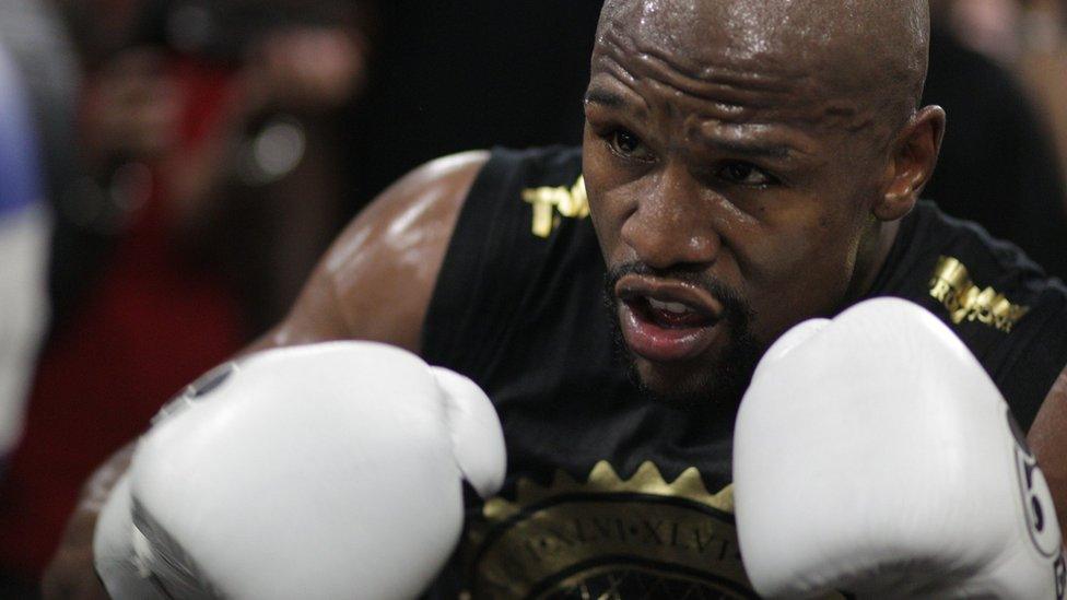 In this file photo taken on August 10, 2017 Boxer Floyd Mayweather Jr. goes through moves during a media workout at the Mayweather Boxing Club in Las Vegas, Nevada