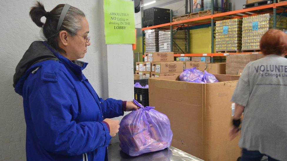 Corin picks up food at the food pantry