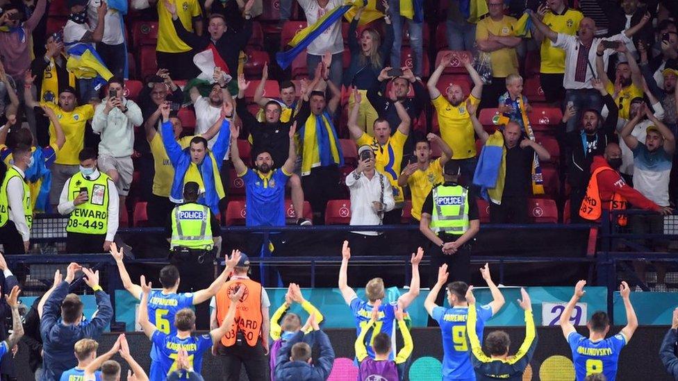 Players of Ukraine celebrate with fans after beating Sweden and Ukraine at Hampden Park in Glasgow