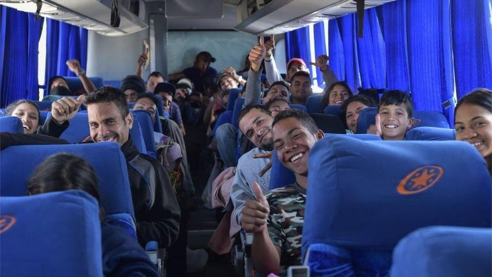 A group of Venezuelan migrants travelling to Peru by bus, make a stop in the outskirts of Quito