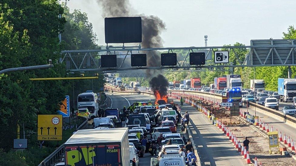 Car on fire on M4, causing queue of traffic