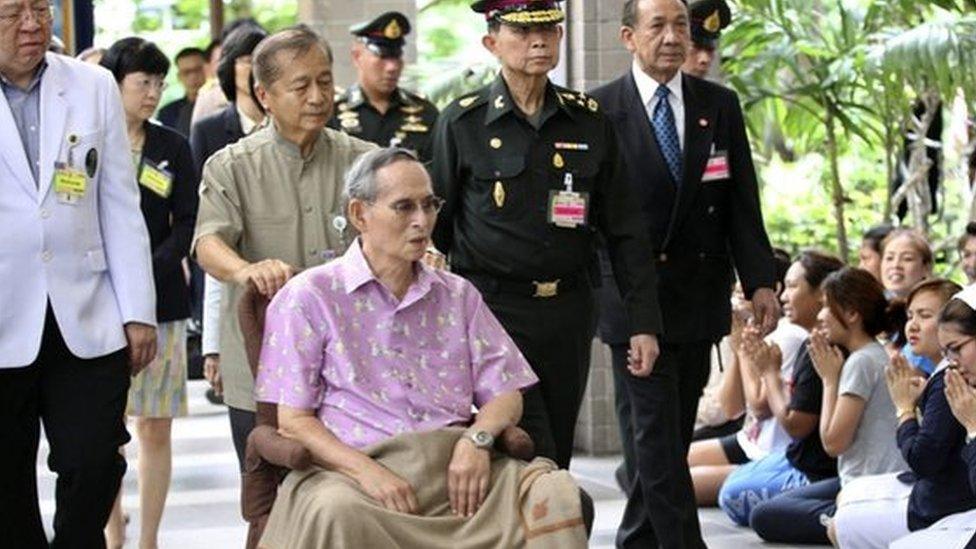 Thai King Bhumibol Adulyadej sits in a wheelchair at a hospital in Bangkok, Thailand, 13 September 2014