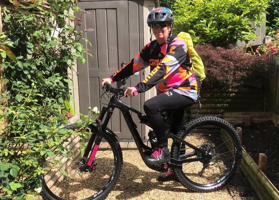 Dom Thompson on her e-bike