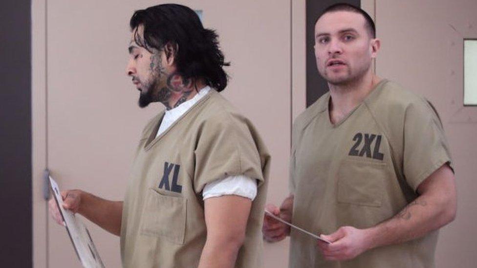 Men cast their ballots at Cook County Jail during the Illinois primary election