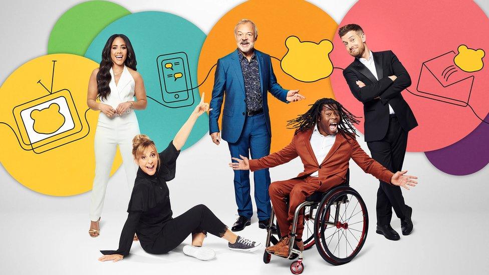 Children in Need presenters Alex Scott, Graham Norton, Mel Gideroyc, Ade Adepitan and Chris Ramsey smiling