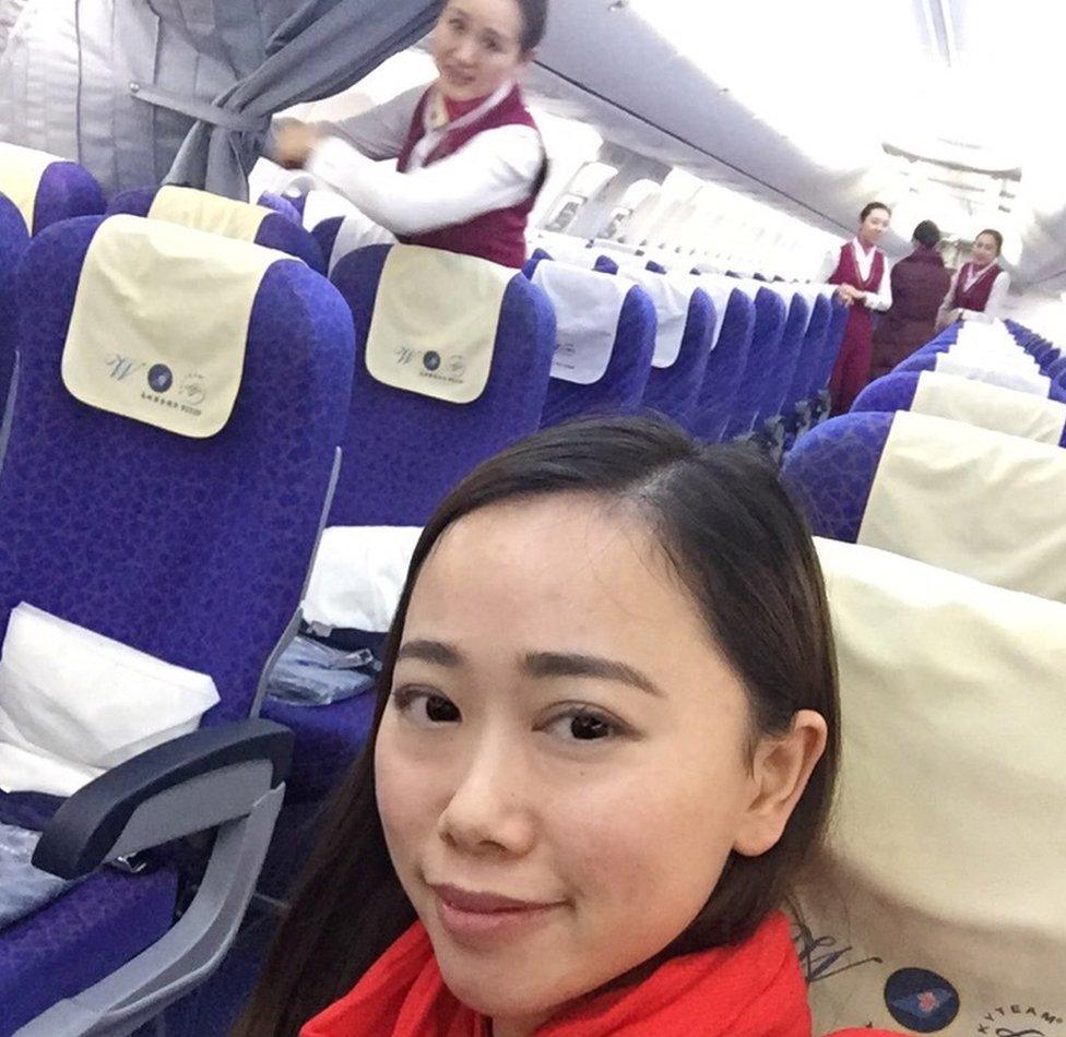 Ms Zhang seated onboard the flight