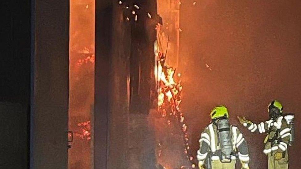 Firefighters tackling a barn fire