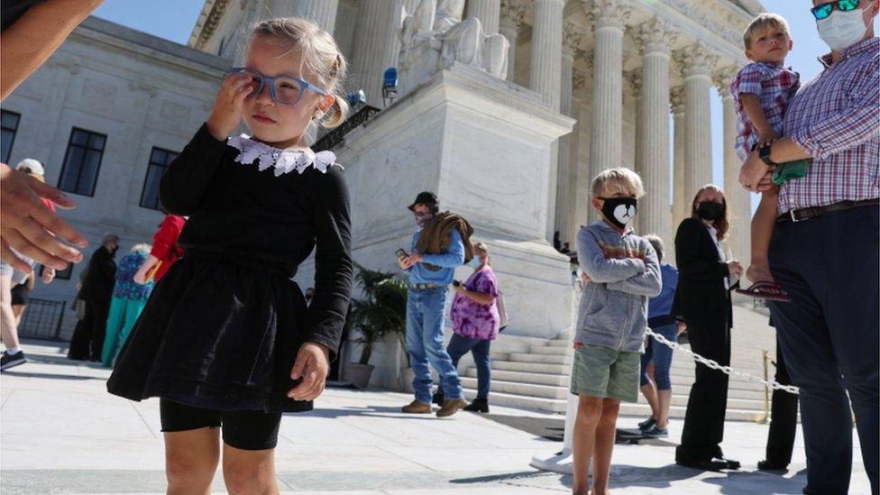 A girl dressed as RBG