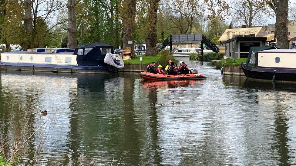 Lifeboat searching for boy on a river