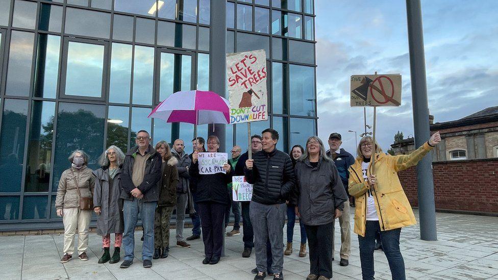 Protestors outside a building