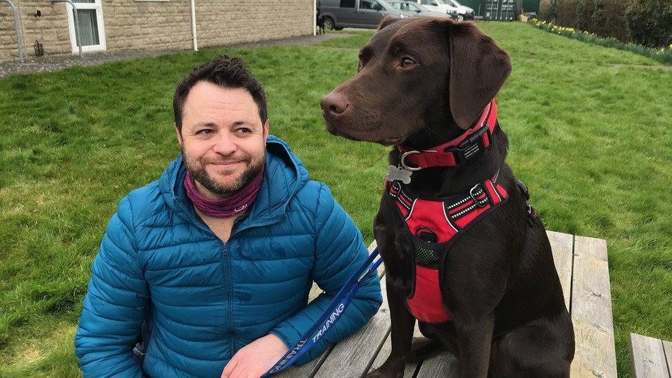 Craig with his support dog Bella