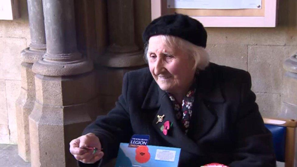 Olive Cooke selling poppies at Bristol Cathedral