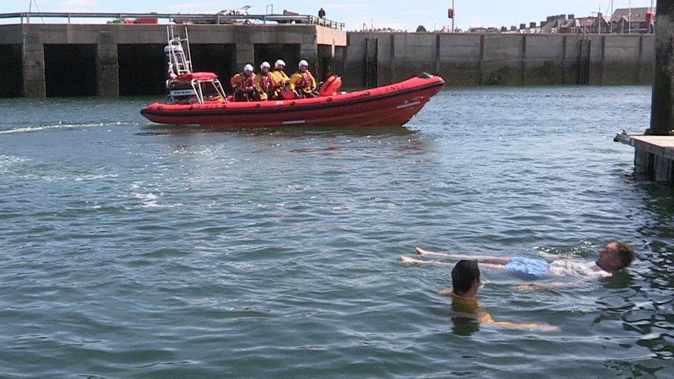 William's friend, Aaron Vance, helped to demonstrate the float survival skill at the campaign launch at Bangor Lifeboat station