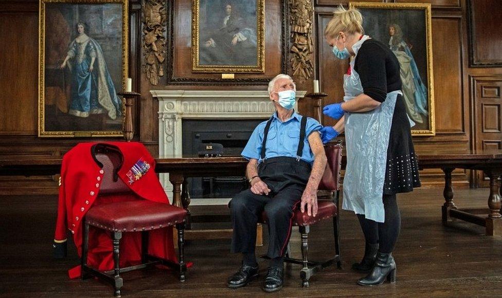 Chelsea Pensioner Bob (Robert) James Sullivan is injected with the Pfizer/BioNTech Covid-19 vaccine by Pippa Nightingale