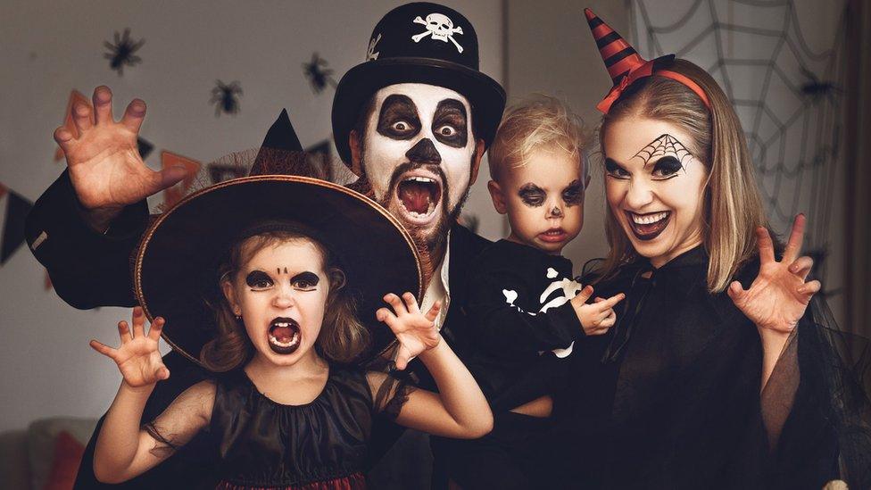 Generic family in Halloween costumes and makeup. Posed by models.