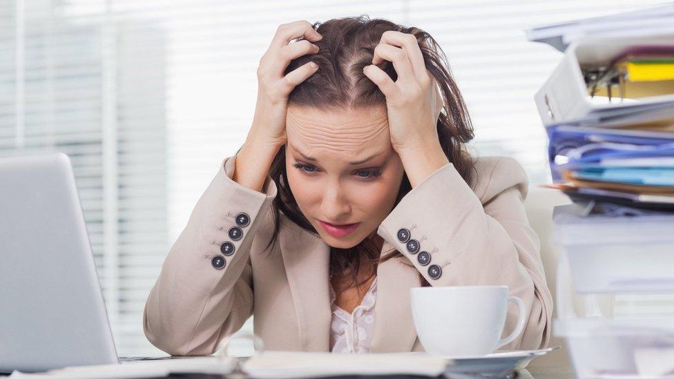 Woman tearing her hair out