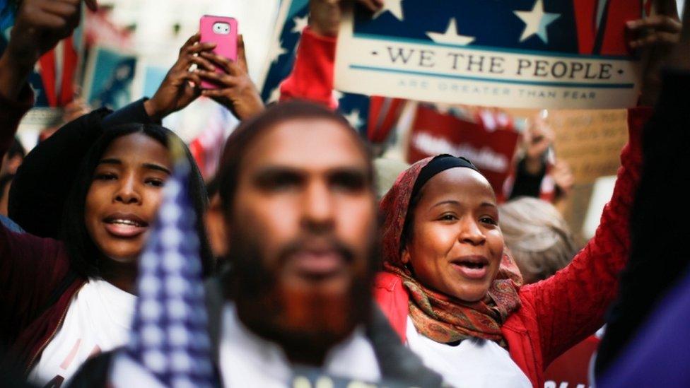 People take part in a rally called "I Am A Muslim Too" in a show of solidarity with American Muslims at Times Square on 19 February 2017 in New York City