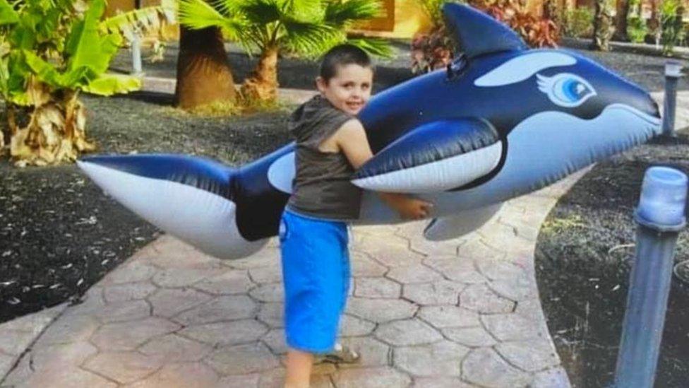 Dylan with an inflatable killer whale