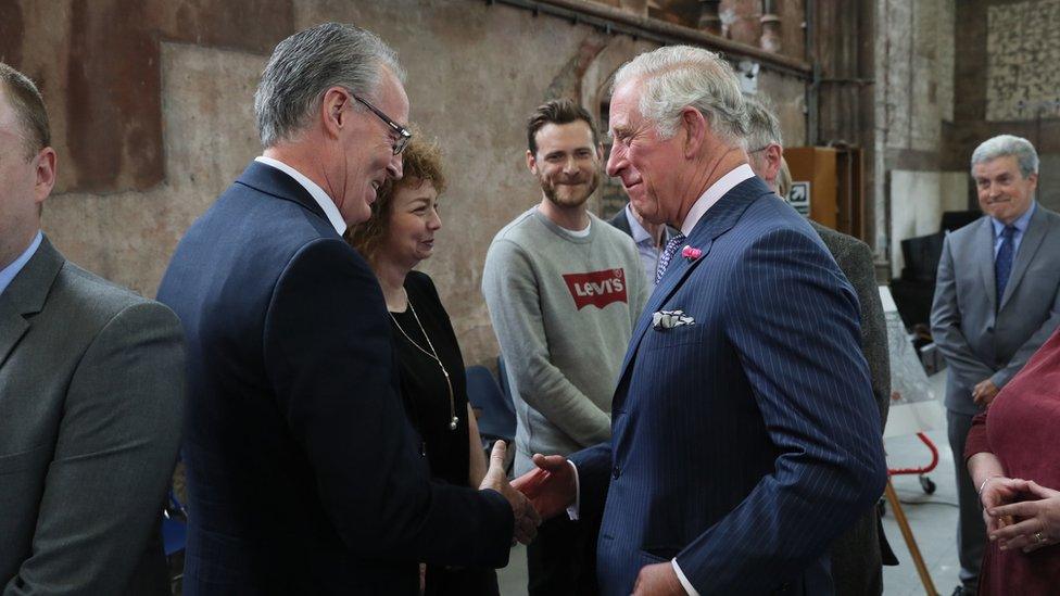 The Prince of Wales shakes hands with Sinn Fein MLA Gerry Kelly at Carlisle Memorial Church in Belfast