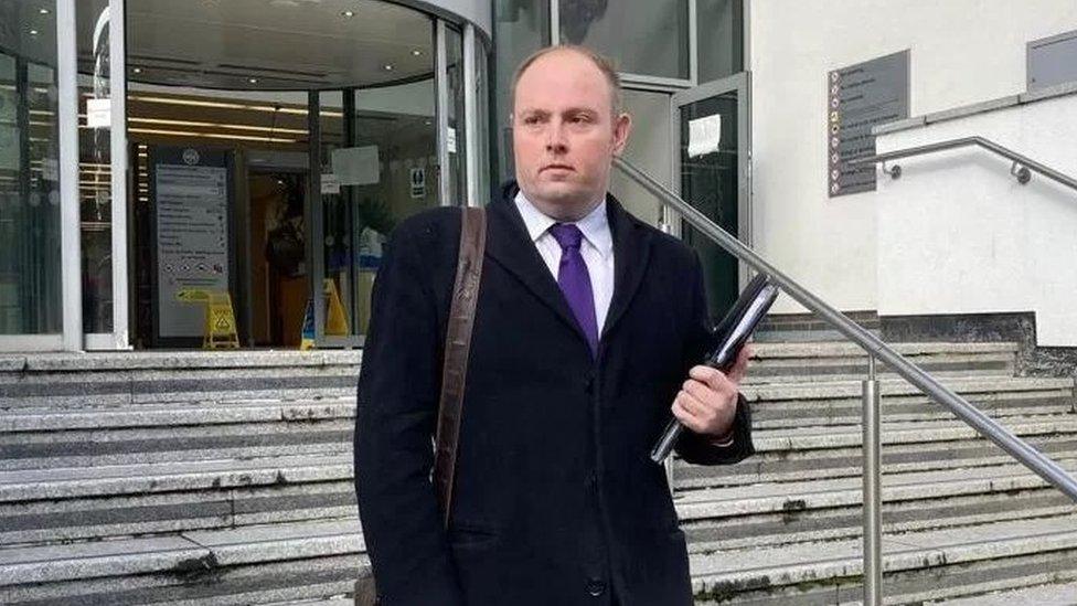 Man walking down the steps of court