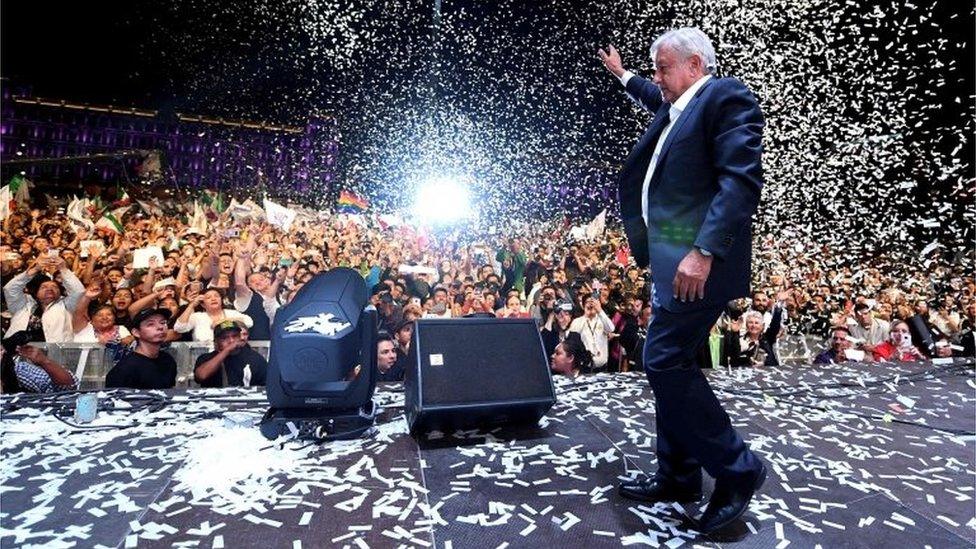 Newly elected President Andres Manuel Lopez Obrador cheers his supporters at the Zocalo Square after winning general elections, in Mexico City, on July 1, 2018