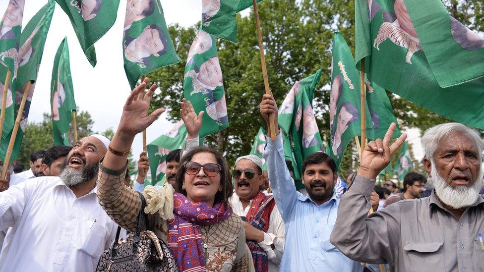 Supporters of the ruling party Pakistan Muslim League-Nawaz (PML-N) celebrate after a Supreme Court verdict on the Panama Papers in Islamabad on April 20, 201