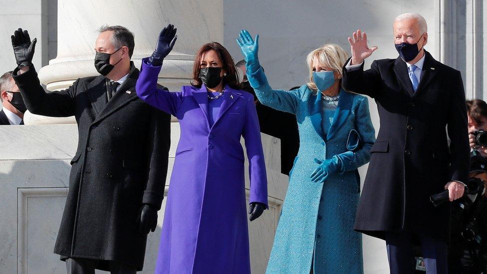 President-elect Joe Biden, his wife Jill Biden, Vice President-elect Kamala Harris and her husband Doug Emhoff salute as they arrive ahead of the inauguration of Biden, in Washington